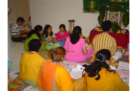 Singing Bhajans at a Bhajan Evening.