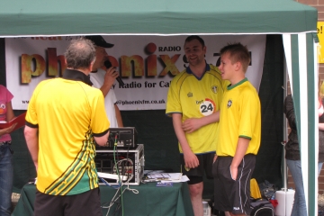Volunteers at roadshow and charity football event 