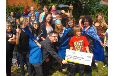 Celebrating a donation to fund a holiday programme