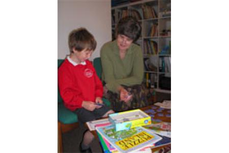 An ARCh volunteer working with a child
