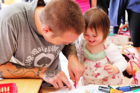 Father and daugher enjoy art workshop