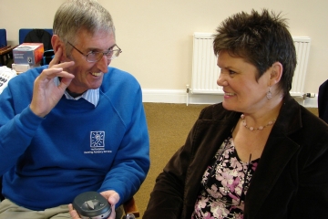 A volunteer discussing equipment with a client