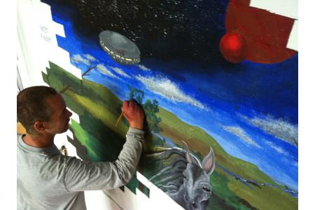 Mick painting his mural at FLACK